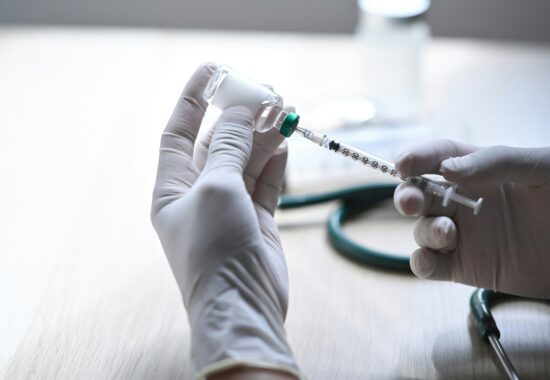 Practitioner preparing a vaccine